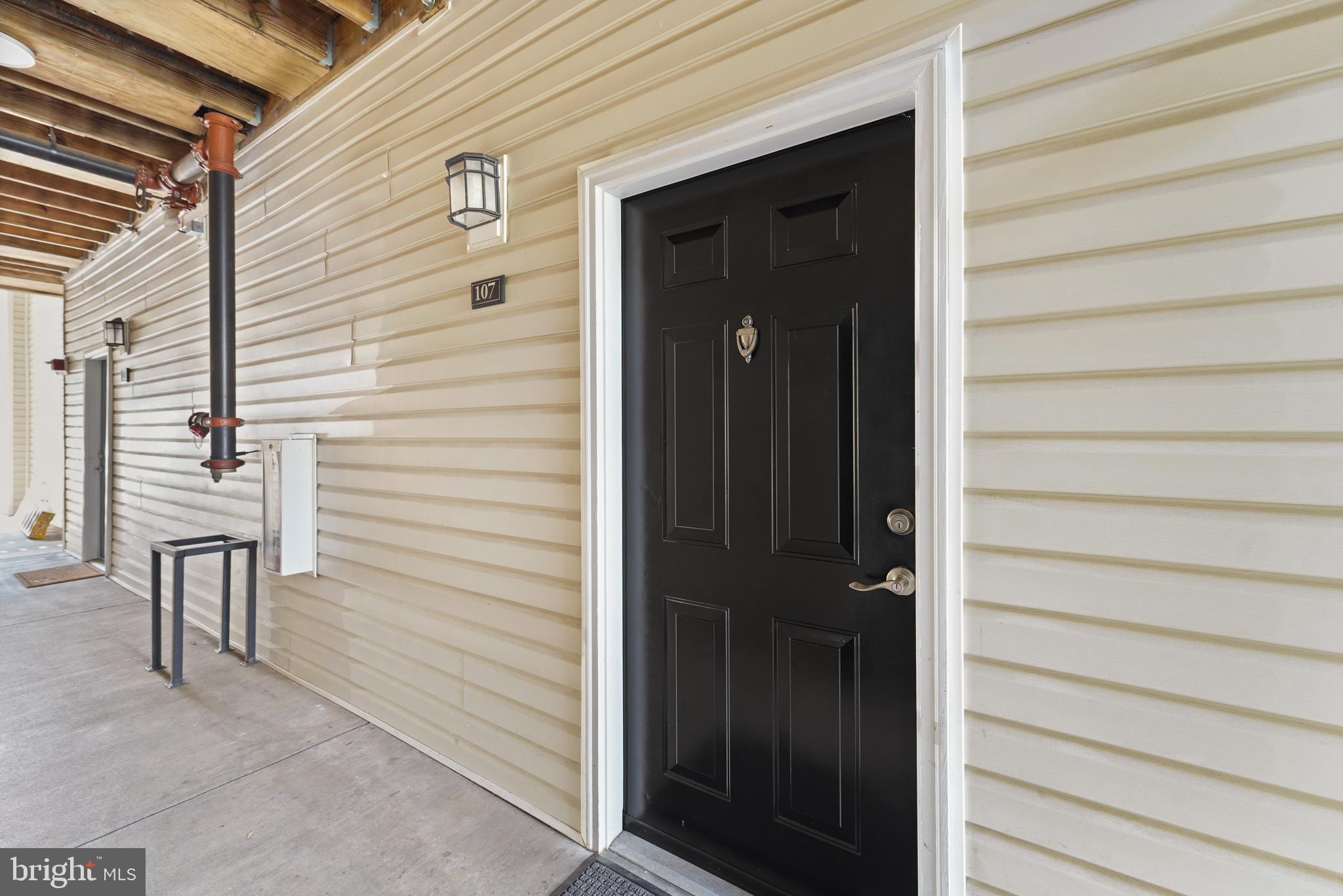 502 Sunset View Terrace Southeast, Unit 107 Leesburg, VA 20175 - Photo 7 of 50 a view of front door and porch