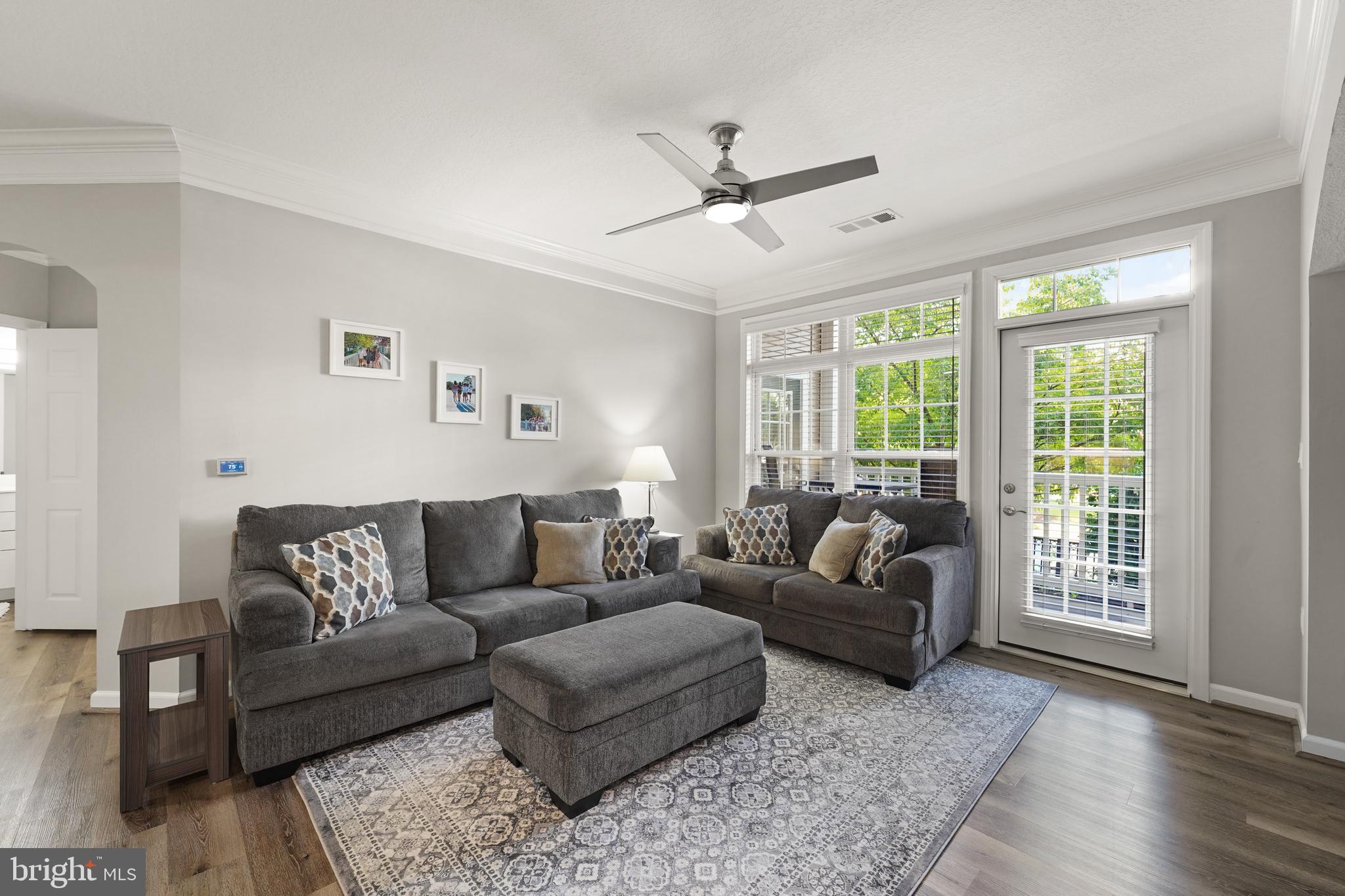 502 Sunset View Terrace Southeast, Unit 107 Leesburg, VA 20175 - Photo 10 of 50 a living room with furniture and a large window