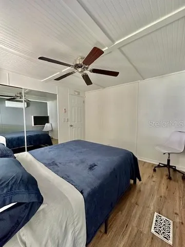 a bedroom with a bed and a walk in closet