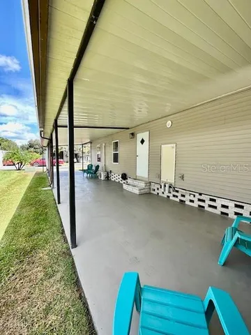 a view of a living room and floor to ceiling window