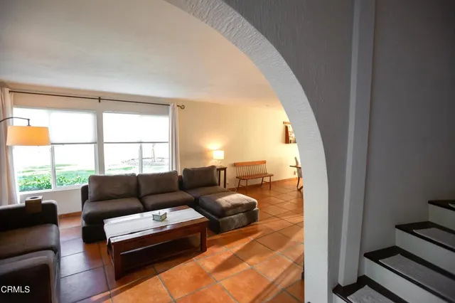 a view of a table and chairs under an umbrella
