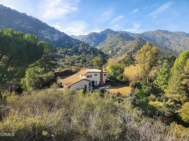 a kitchen with stainless steel appliances a stove a refrigerator and a sink