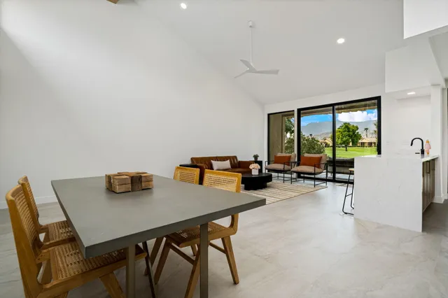 a view of a workspace with furniture and a potted plant