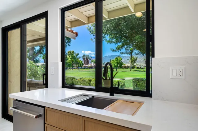 a view of a sink and garden view