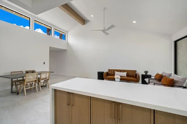 a kitchen with a table and chairs in it