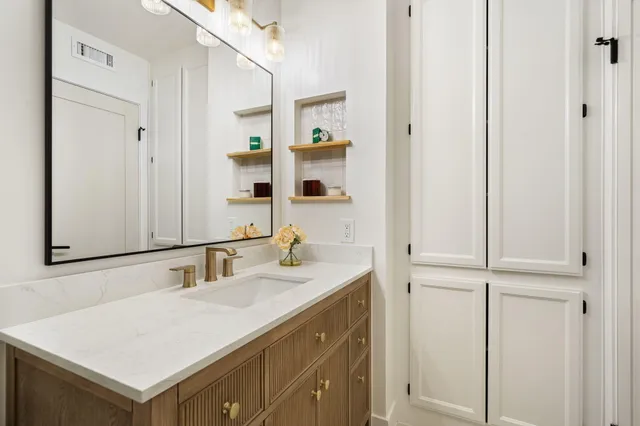 a bathroom with a sink and a mirror