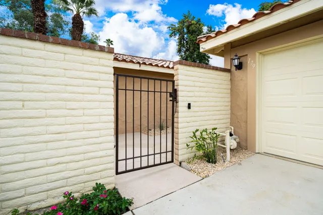 a view of a house with a flower in a garden