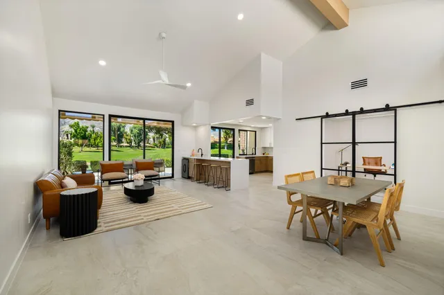 a view of a dining room with furniture window and outside view