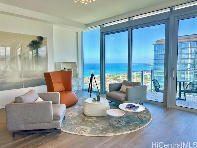 1118 Ala Moana Boulevard, Unit 3403 Honolulu, HI 96814 - Photo 11 of 24 a living room with furniture and a table