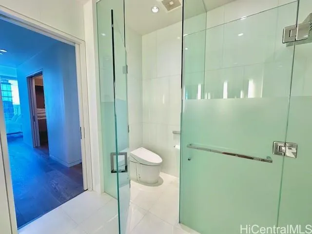 a bathroom with a shower and a sink