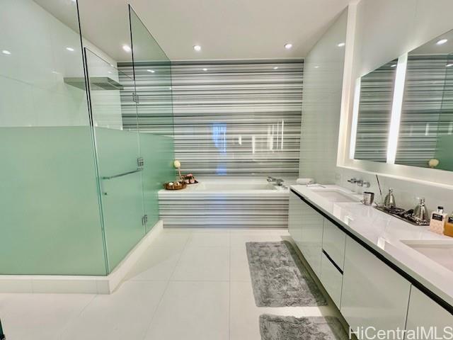 1118 Ala Moana Boulevard, Unit 3403 Honolulu, HI 96814 - Photo 3 of 24 a bathroom with a double vanity sink and large mirror