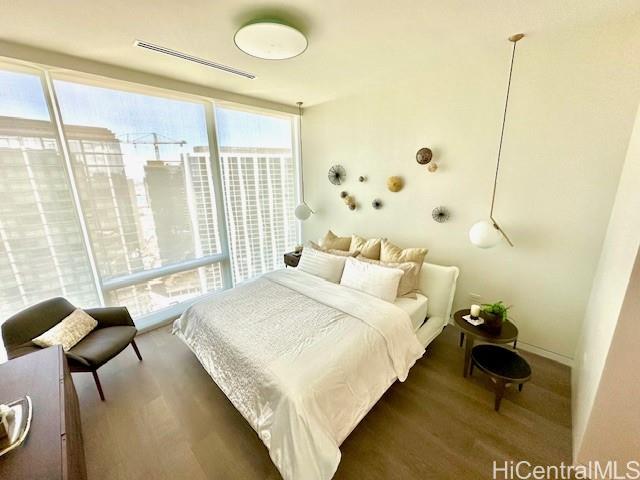 1118 Ala Moana Boulevard, Unit 3403 Honolulu, HI 96814 - Photo 4 of 24 a bedroom with a bed and a window