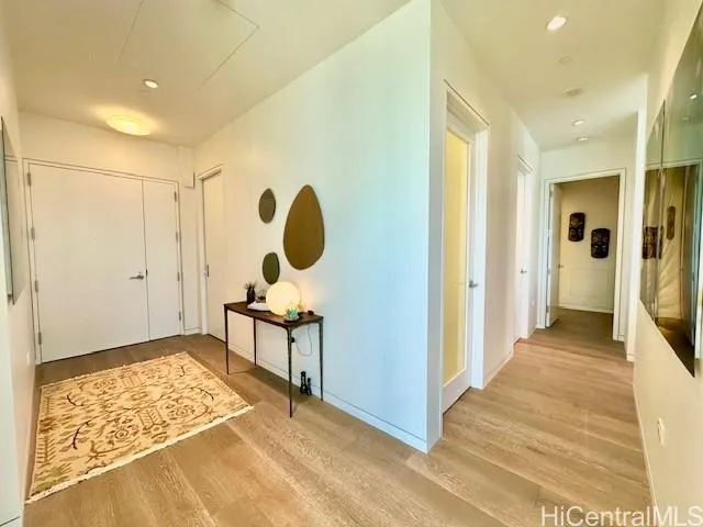 a view of a room with wooden floor and bathroom