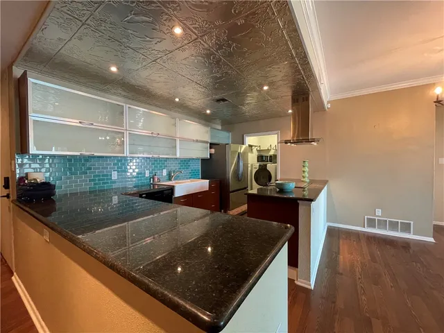 a lobby with furniture and a chandelier