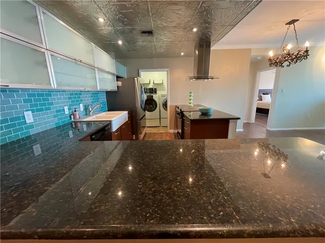 a room with granite countertop furniture and a sink