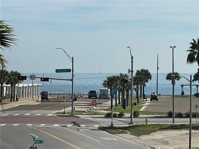 a view of a street with cars