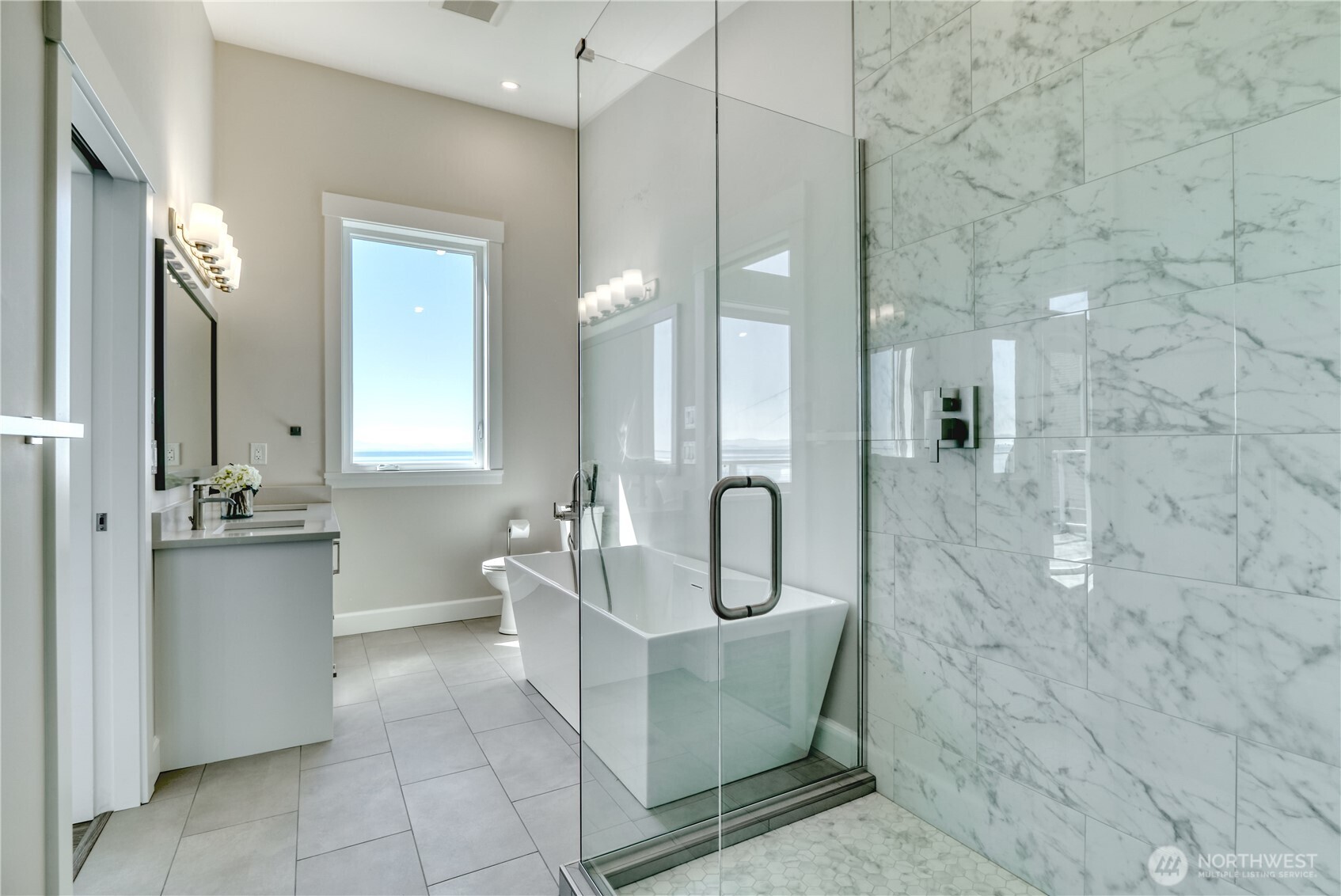 631 Freemans Lane Point Roberts, WA 98281 - Photo 22 of 40 a bathroom with a sink a toilet and mirror