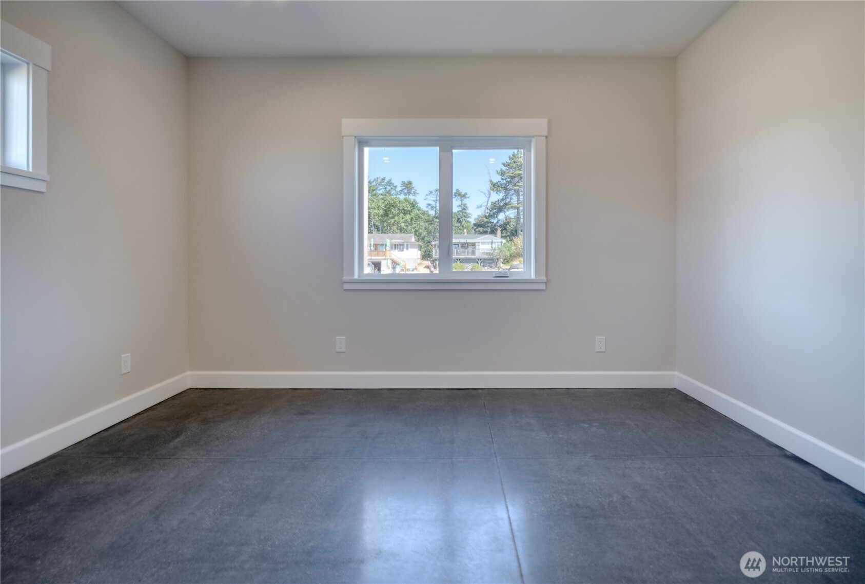 631 Freemans Lane Point Roberts, WA 98281 - Photo 34 of 40 an empty room with wooden floor and windows