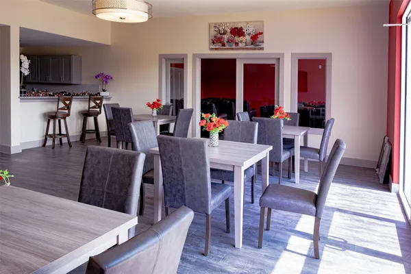 a view of a dining room with furniture window and wooden floor