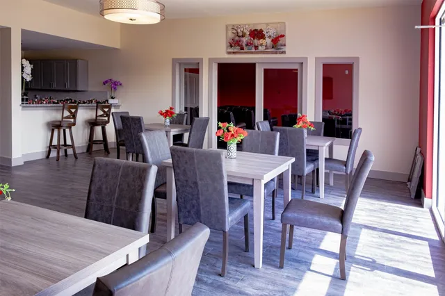 a view of a dining room with furniture window and wooden floor
