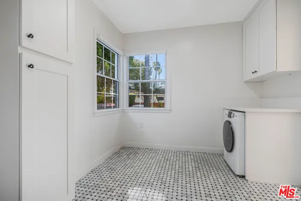 a bathroom with a glass door shower
