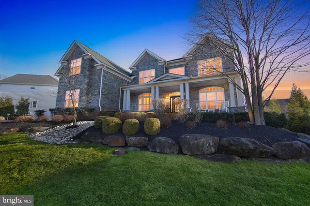 a front view of house with yard and outdoor seating