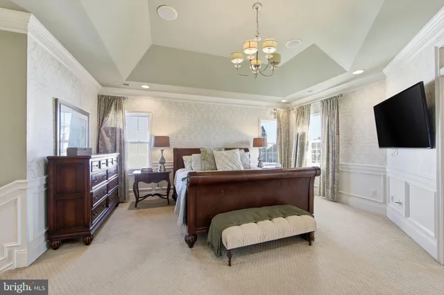 a bathroom with a granite countertop sink mirror and a toilet