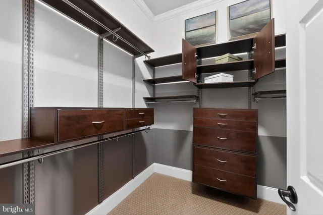 a bedroom with a bed wooden floor and window
