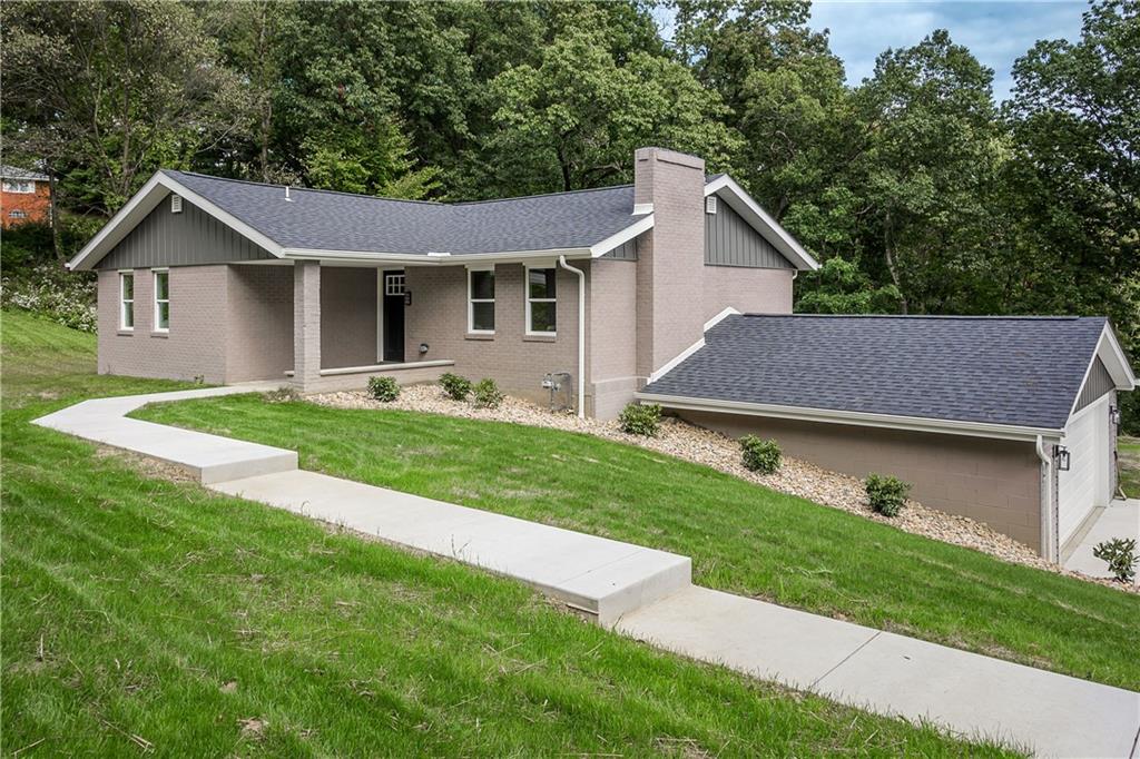 2392 Ridge Rd Extension Ambridge, PA 15003 - Photo 1 of 37 a aerial view of a house with a yard and large trees