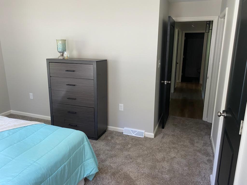 2392 Ridge Rd Extension Ambridge, PA 15003 - Photo 12 of 37 a bedroom with a bed and a mirror