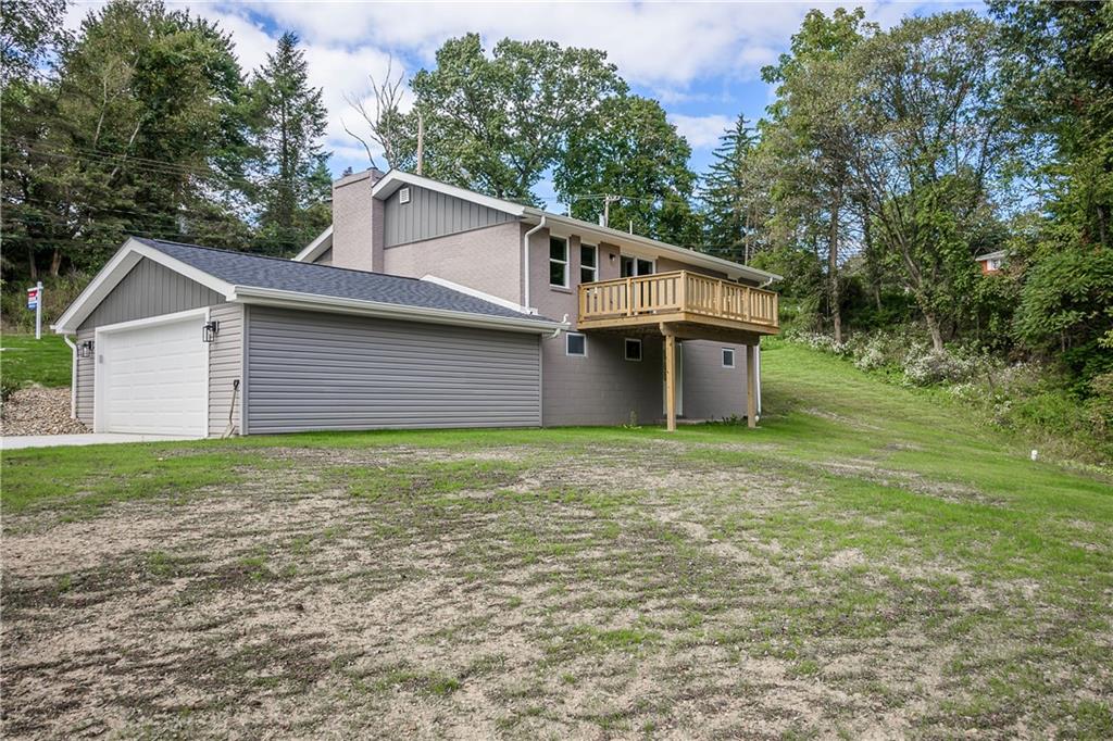 2392 Ridge Rd Extension Ambridge, PA 15003 - Photo 3 of 37 a view of a backyard with barn and large trees