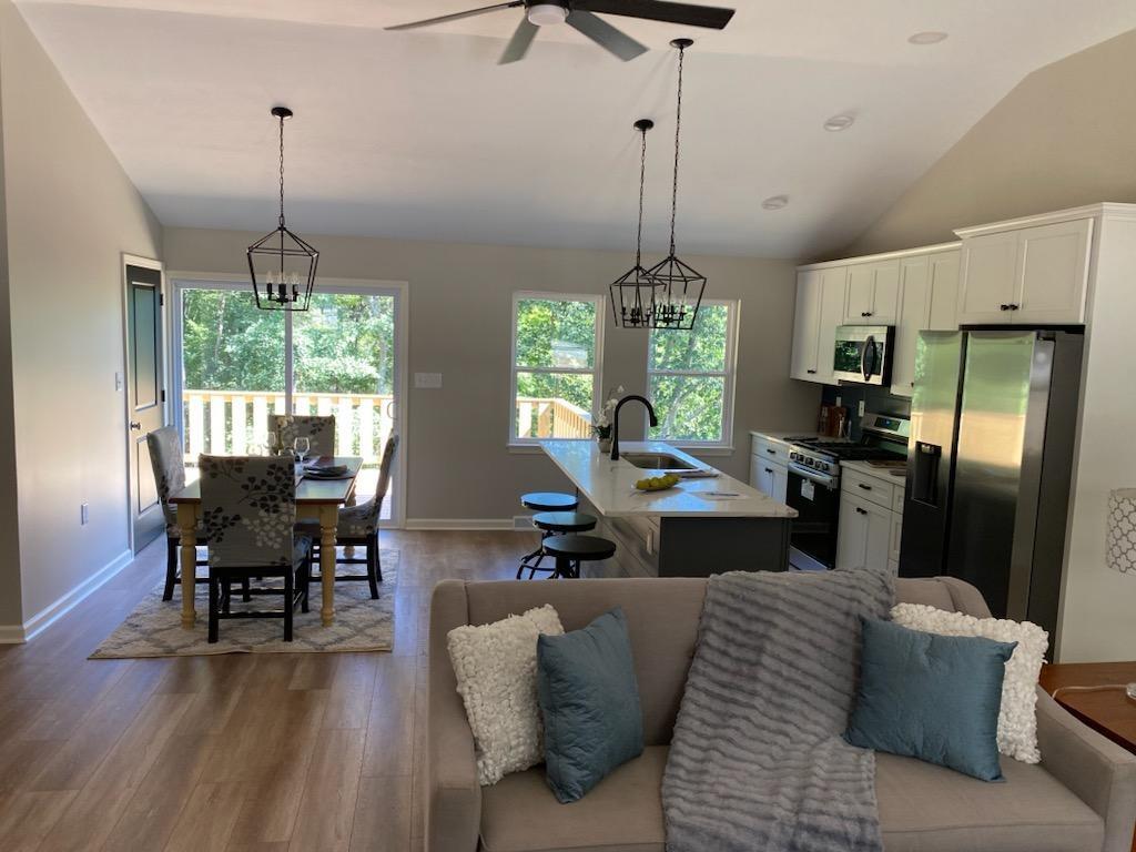 2392 Ridge Rd Extension Ambridge, PA 15003 - Photo 5 of 37 a living room with furniture a chandelier and a chandelier
