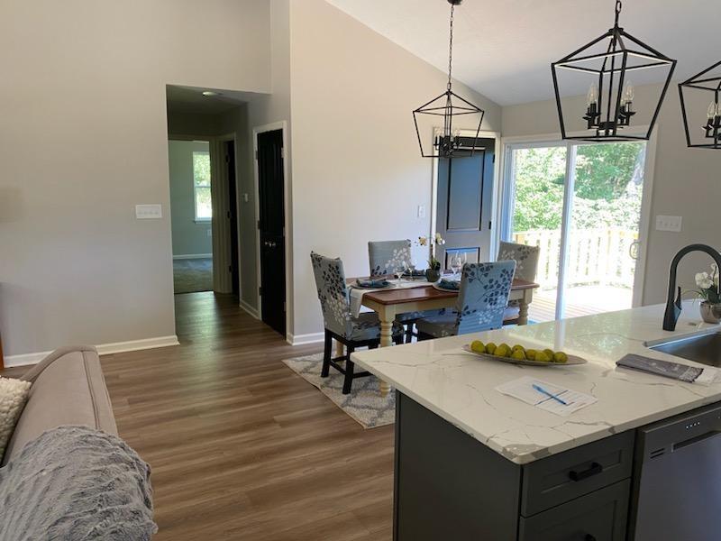 2392 Ridge Rd Extension Ambridge, PA 15003 - Photo 8 of 37 a dining room with a table and chairs