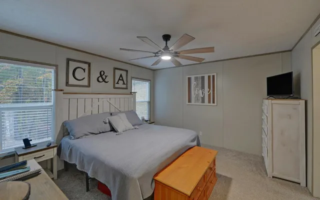 a bedroom with a bed and a walk in closet