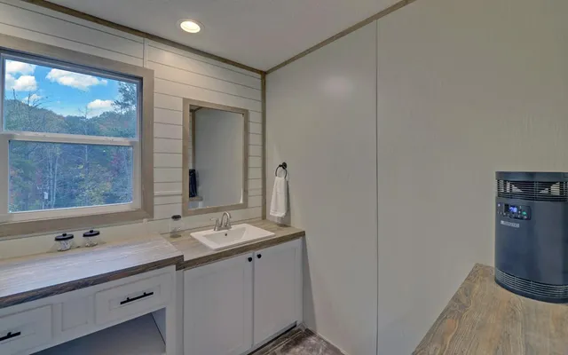 a bathroom with a glass shower door
