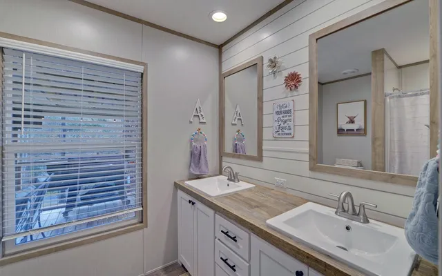 a bathroom with a toilet and a shower curtain