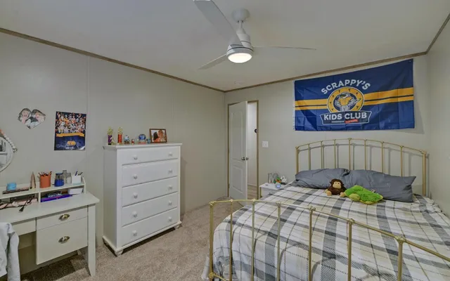 a bedroom with a bed and a table in it