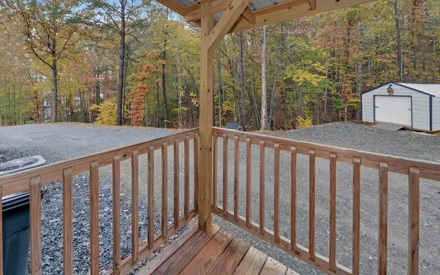 a backyard of a house with barbeque oven table and chairs