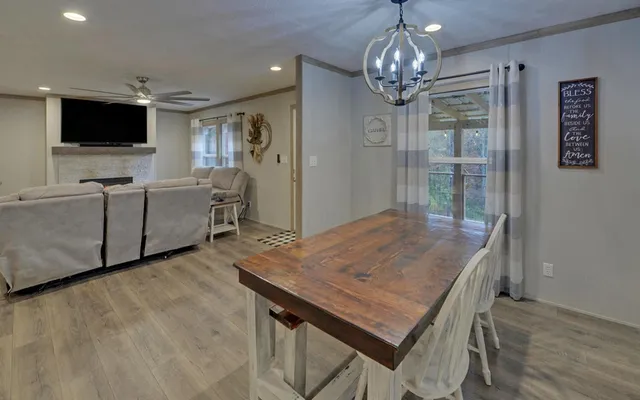 a kitchen with a sink a counter space appliances and cabinets