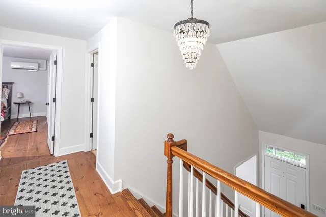 a view of a hallway view with staircase