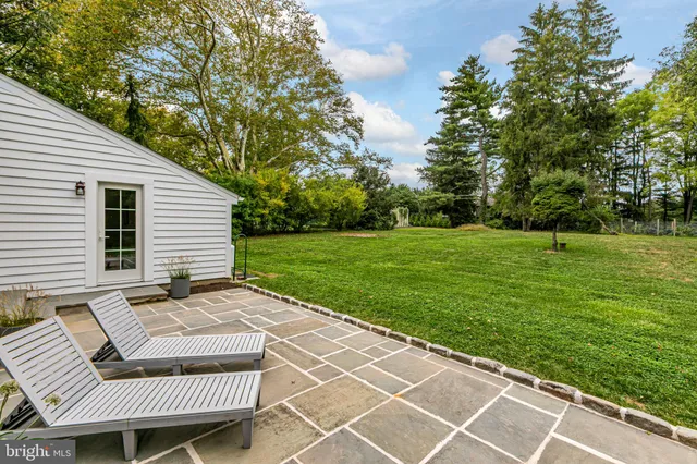 a view of a patio with a yard
