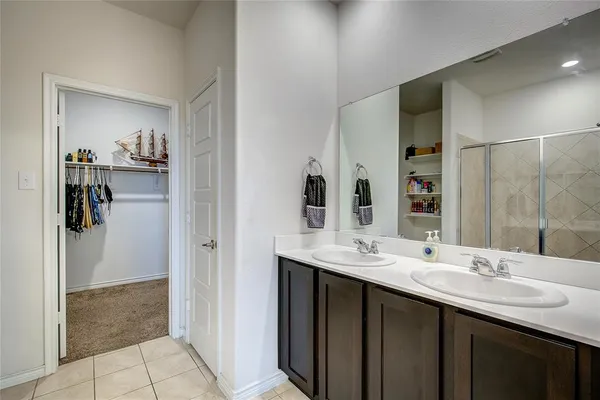 a view of kitchen with food items with wooden floor