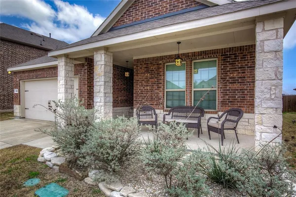 a garden view with a seating space