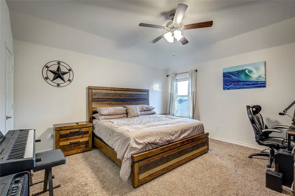 a view of walk in closet with clothes