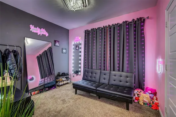 a bedroom with bed and a window