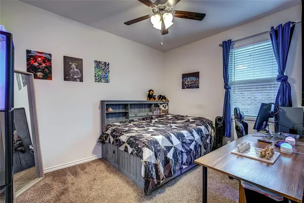 a brick building with a bench and a table