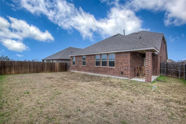 a view of a swimming pool with a yard
