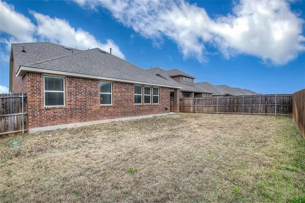a view of a lake with a yard