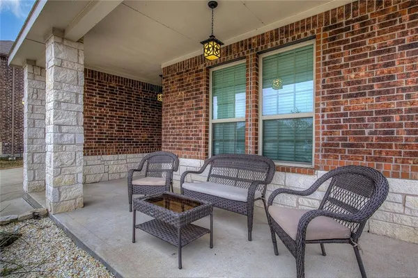 a outdoor living space with furniture and a window