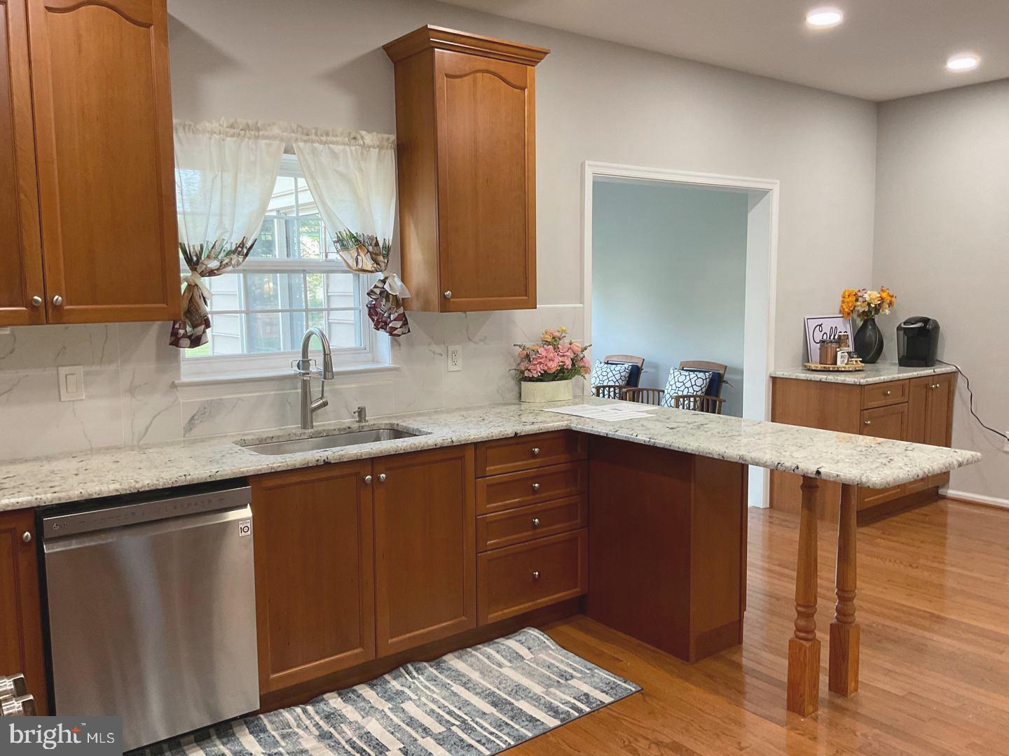 54 Arbor Circle Colmar, PA 18915 - Photo 17 of 74 a kitchen with a sink cabinets and wooden floor